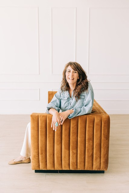 Paige Williams sitting in an armchair